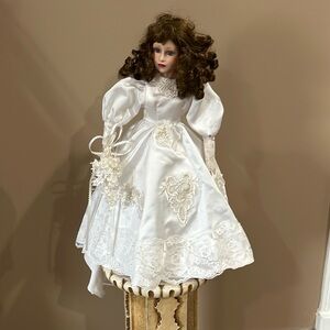 Wedding doll with dress and shoes on stand,